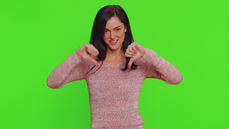 Upset-young-woman-girl-in-sweater-showing-thumbs-down-sign-gesture-disapproval-dissatisfied-dislike