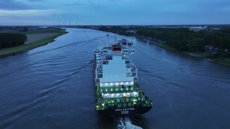 A-newly-built-in-2023-container-ship-Vega-Daytona-is-being-shot-the-its-tail-on-the-River-Dortse-Kil,-Netherlands