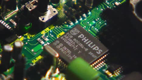 Slow-zoom-in-to-philips-intel-chip-placed-in-retro-cricuit-board