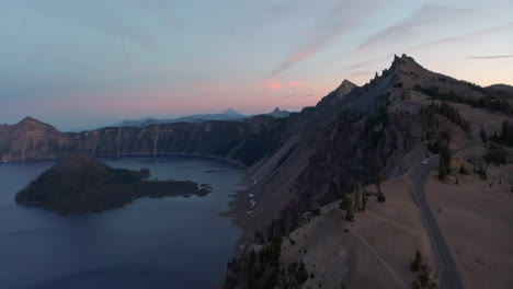 Descending-aerial-shot-over-Crater-Lake-Oregon-at-sunset