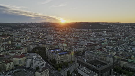 Prague-Czechia-Aerial-v63-panoramic-panning-view-drone-flyover-and-around-Grand-National-Museum-capturing-cityscape-of-old-and-new-town-at-sunset-golden-hours---Shot-with-Mavic-3-Cine---November-2022