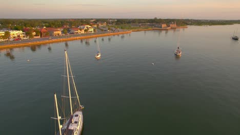 Breathtaking-aerial-journey-of-the-serenity-of-a-Saint-Augustine-sunrise-over-the-tranquil-river-waters