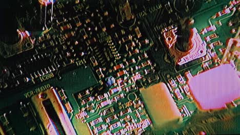 Circuit-board-macroshot,-glitch,-analog-electronic-board-with-distortion,-colorful-glitching-pattern,-matrix-glitches,-interference,-TV-noise,-electronics,-motherboard-error,-crashing,-computer-crash