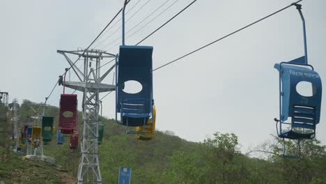 Single-person-ropeway-running-on-the-top-of-Ratnagiri-Hill,-Wide-angle-shot