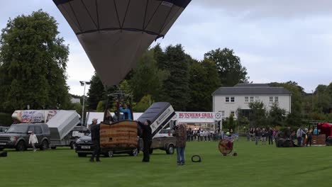Slow-motion-shot-of-a-hot-air-balloon-taking-off-at-the-Strathaven-Balloon-Festival