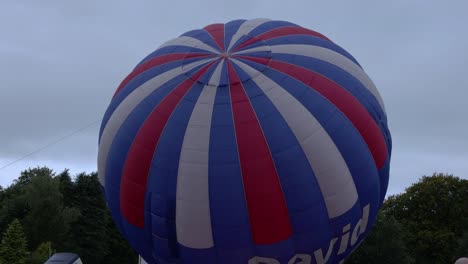Hand-held-shot-of-a-rising-hot-air-balloon-at-the-Strathaven-Balloon-Festival