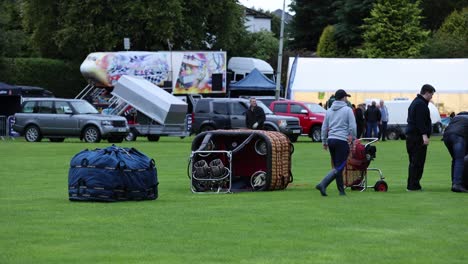 Hand-held-shot-of-crews-setting-up-at-the-Strathevn-Balloon-Festival