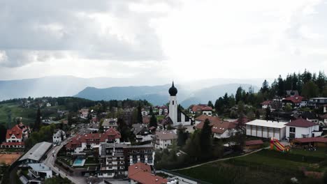 Establishing-aerial-view-of-Italy's-quaint-countryside-town-of-Oberbozen
