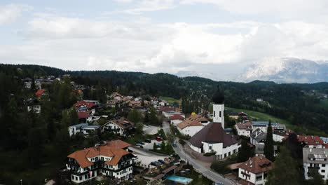 Drone-shot-of-Oberbozen-and-the-surrounding-lush-countryside-of-Italy