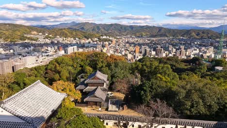 View-from-the-castle-towers-ont-the-yard-an-roofs-of-Matsuyama-Castle,-Shikoku,-Ehime,-Japan