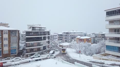 A-slow,-drone-like-ascent-captures-a-snowy-day-in-Denizli,-Turkey
