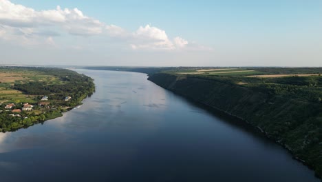 Birds-eye-View-of-Dniester-River-Timeless-Water,-which-Flows-Through-Picturesque-Countryside-of-Moldova-and-Ukraine,-Peaceful-Evening