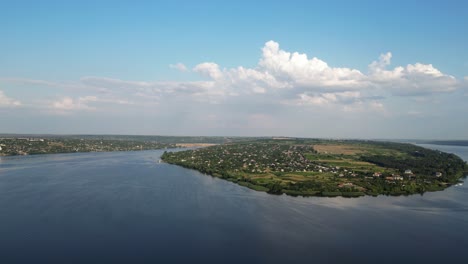 Breathtaking-View-of-the-Dniester-Riverbanks-and-Tiny-Riverside-Village-with-Traditional-Moldovan-Motifs,-somewhere-near-Ukraine,-4K-Birds-eye-view