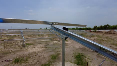 Digital-protractor-paced-on-solar-panel-array-steel-beam-structure-measuring-tilt-angles