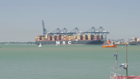 MSC-Mega-Container-Ship-docked-at-Harwich-port,-cranes-unloading
