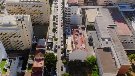 Drone-shot-following-a-car-on-the-street-in-Marbella,-Spain