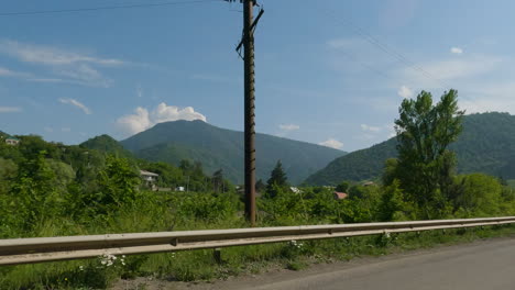 Navigating-On-Asphalt-Road-With-Scenic-Mountain-Landscape-In-Georgian-Countryside