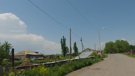 Driving-On-The-Street-In-Georgian-Village-Through-Rural-Houses
