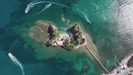 Birds-Eye-Aerial-View-of-Cameo-Island,-Boats,-Beach-and-Bridge-Connected-to-Zakynthos,-Greece,-High-Angle-Drone-Shot
