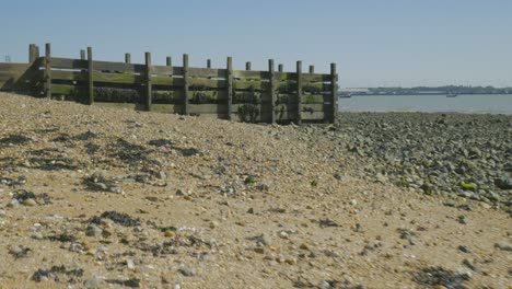 Low-angle-footage-of-Harwich-stone-beach-at-low-tide