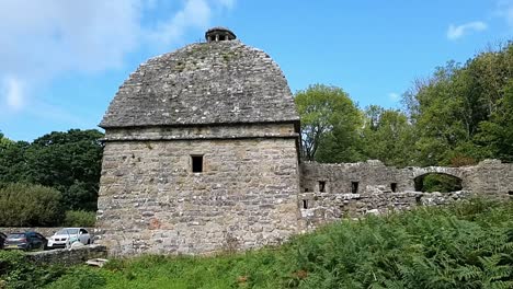 Old-stone-Penmon-dovecot-on-secluded-fern-covered-Welsh-countryside-grounds