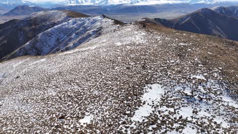 Aerial-wide-landscape-of-high-mountain-peaks-over-the-summit-during-beautiful-winter,-New-Zealand