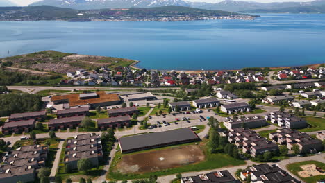 Tromso-neighborhood-on-banks-of-fjord-in-Norway,-scenic-aerial-view
