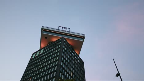 Looking-Up-At-The-A'DAM-Tower-Observation-Deck-During-Sunset-In-Amsterdam,-Netherlands