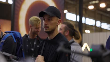 Man-standing-at-the-DJI-booth-of-IFA-2023-Berlin