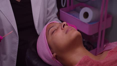 Young-latina-at-a-spa-getting-facial-skin-care-treatment