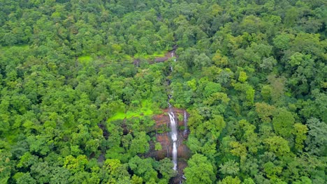 waterfall-in-greenery-forest-drone-view