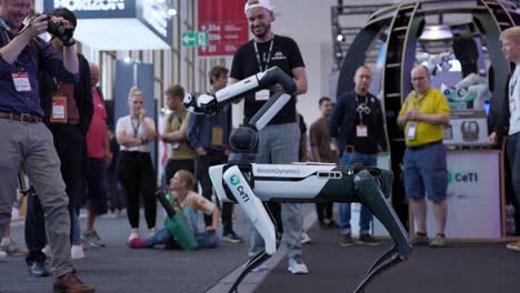 Boston-Dynamics-walking-robot-dog,-with-a-robotic-arm-on-its-body