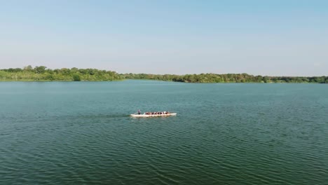 Aerial-drone-view-of-a-Long-boat-rowing-team-training-on-Kramer-lake-in-Pasadena-Texas