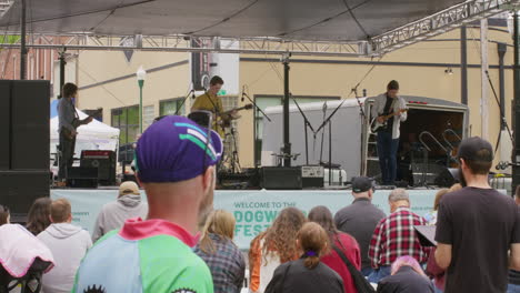 Group-Of-Young-Men-Performing-Live-On-Stage-In-Front-Of-Audience-During-The-Dogwood-Festival