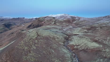 Aerial-View-Of-Reykjadalur-Valley-After-First-Snow-In-Winter-In-South-Iceland