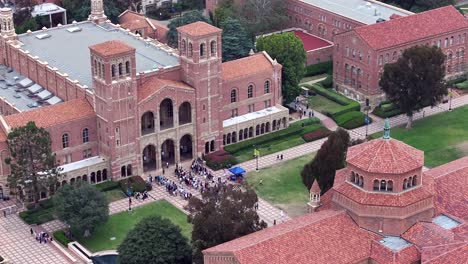 Aerial-view-around-people-gathered-in-front-of-the-Royce-Hall-building-at-UCLA