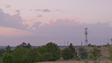 Sunset-with-communication-tower-silhouetted-against-magenta-colour-sky