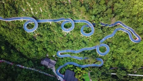 Aerial-drone-shot-of-the-whole-curved-Kart-Race-Track-in-theme-Park,-Tonglu,-China