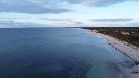 Descending-View-Over-Geographe-Bay-With-Gentle-Waves-Lapping-Shore