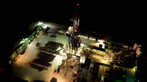 Illuminated-Oil-Rig-Drilling-Platform-At-Night
