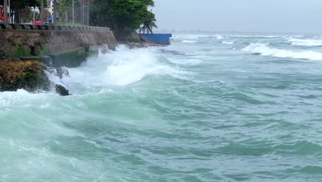 Aerial-flyover-Caribbean-sea-with-crashing-waves-against-coastline-while-hurricane-season-in-Dominican-republic