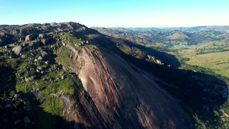Drone-shot-flying-backwards-over-mountain-range-in-Eswatini-in-Africa