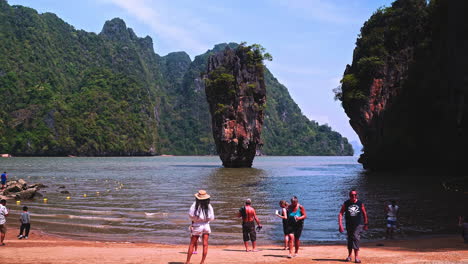 People-visiting-Phang-Nga-bay-on-James-Bond-island-with-rock-pillar