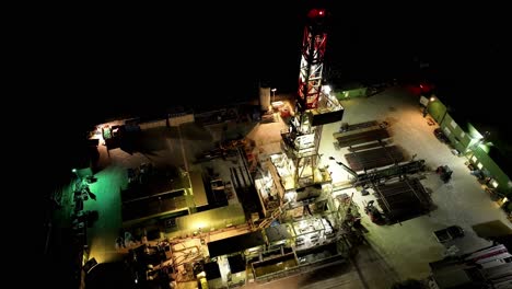Topdown-View-Of-Fixed-Offshore-Oil-Platform-Illuminated-At-Night
