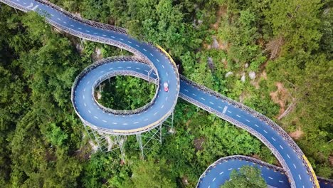 Aerial-drone-shot-of-curved-Kart-Race-Track-in-theme-Park,-Tonglu,-China