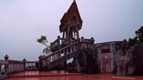 Ornate-shrine-with-stairway-on-terrace-of-buddhist-Tiger-cave-temple