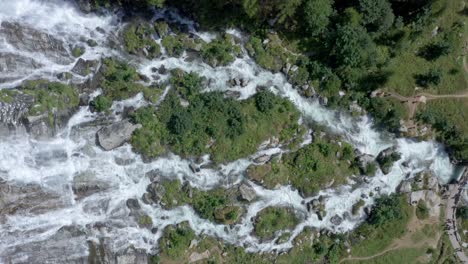 Aerial-top-down-riser-shot-of-Cascata-del-Toce-waterfall-cascading-down-cliff