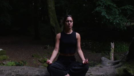 Outdoor-yoga-session---Hispanic-woman-sitting-deeply-focused