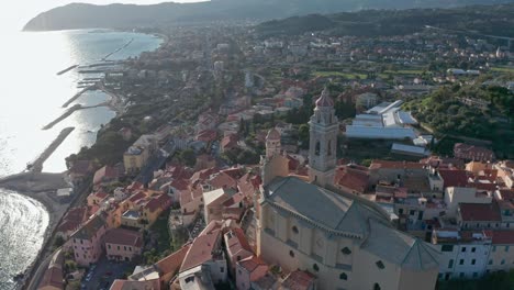 Drone-flight-over-San-Giovanni-Battista-church-with-epic-view-of-Cervo-coastline
