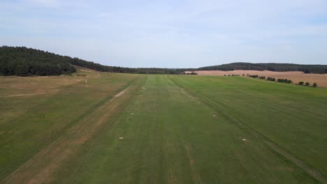 helicopter-landing-rural-meadow-runway-in-airplane-takeoff